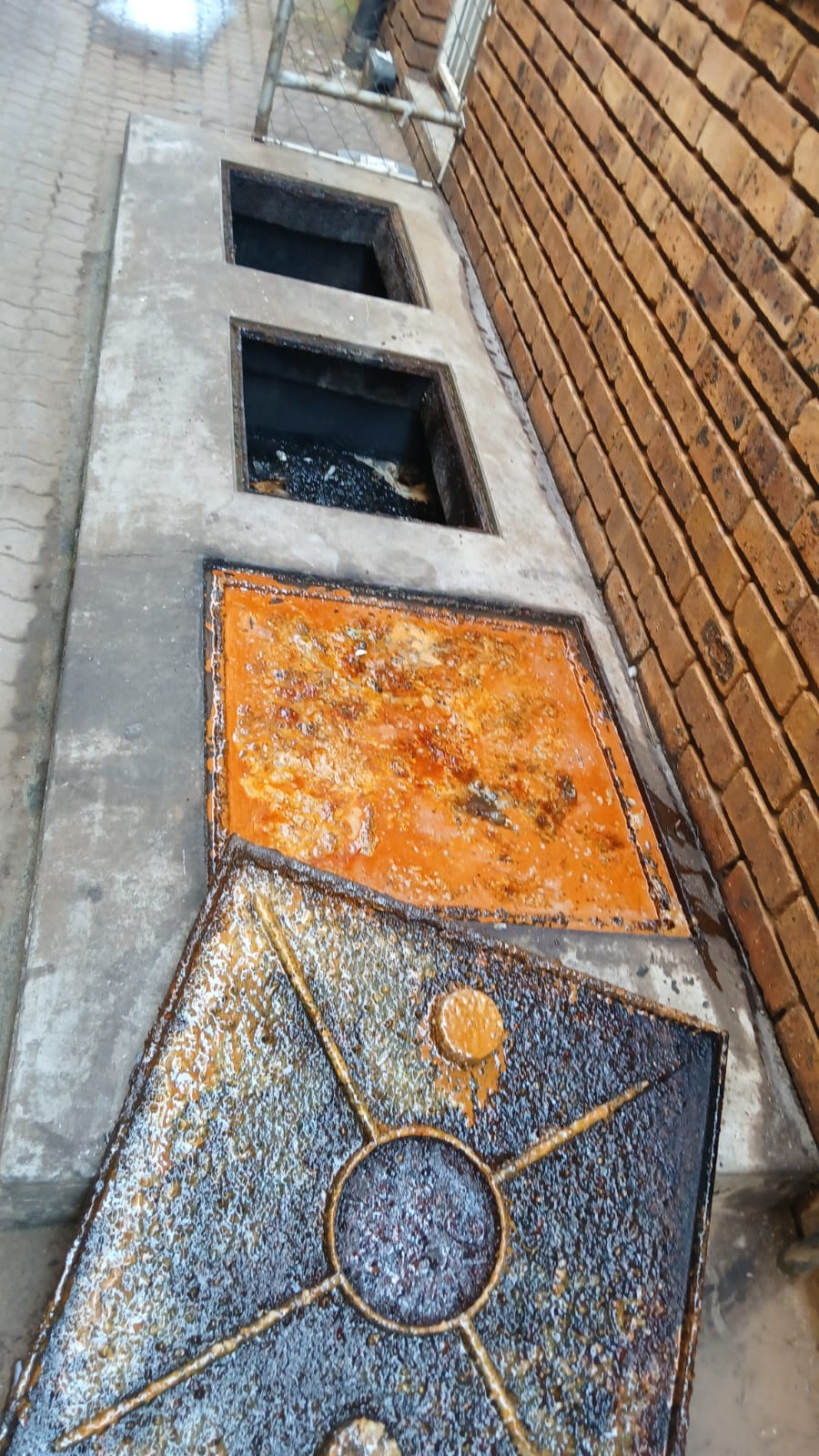 Blocked grease trap before cleaning at Pretoria atchar factory