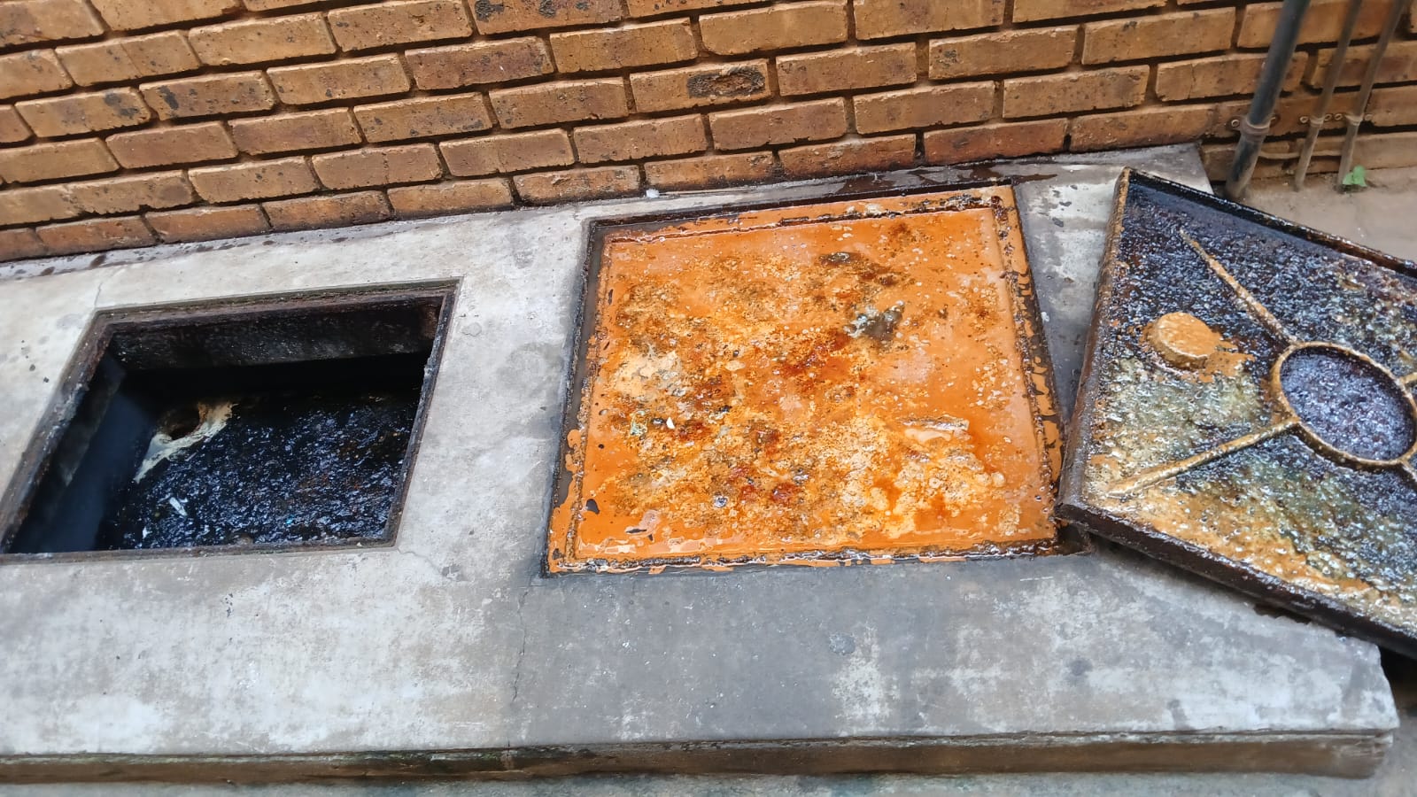 High-pressure water jetting in progress on blocked drain