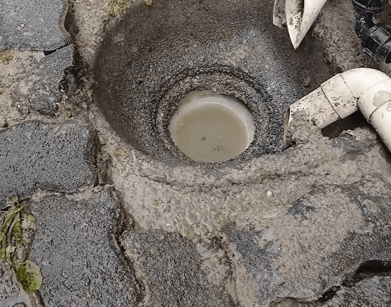 During: water jetting process breaking up the grease blockage