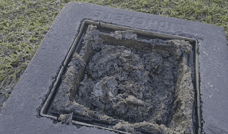 Before: blocked drain packed with toilet paper in Garsfontein